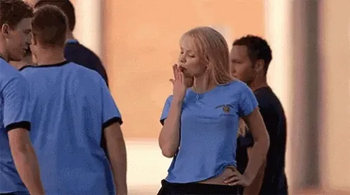 girl bowing seductive kisses to a guy using the push-pull flirting method