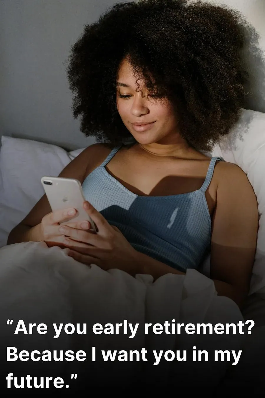Young woman reading Tinder pick up lines on her phone while in bed.